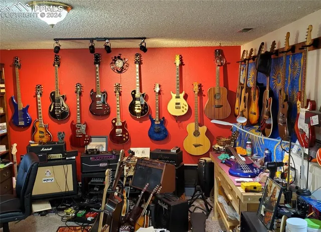 a room with furniture and gym equipment