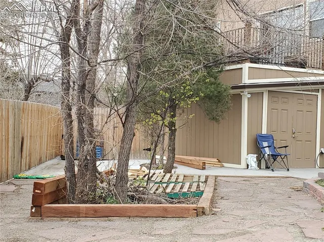 a view of a outdoor space with a patio and fire pit