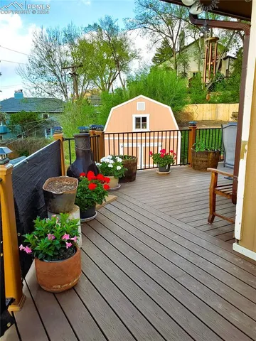 a view of a house with garden and a garden
