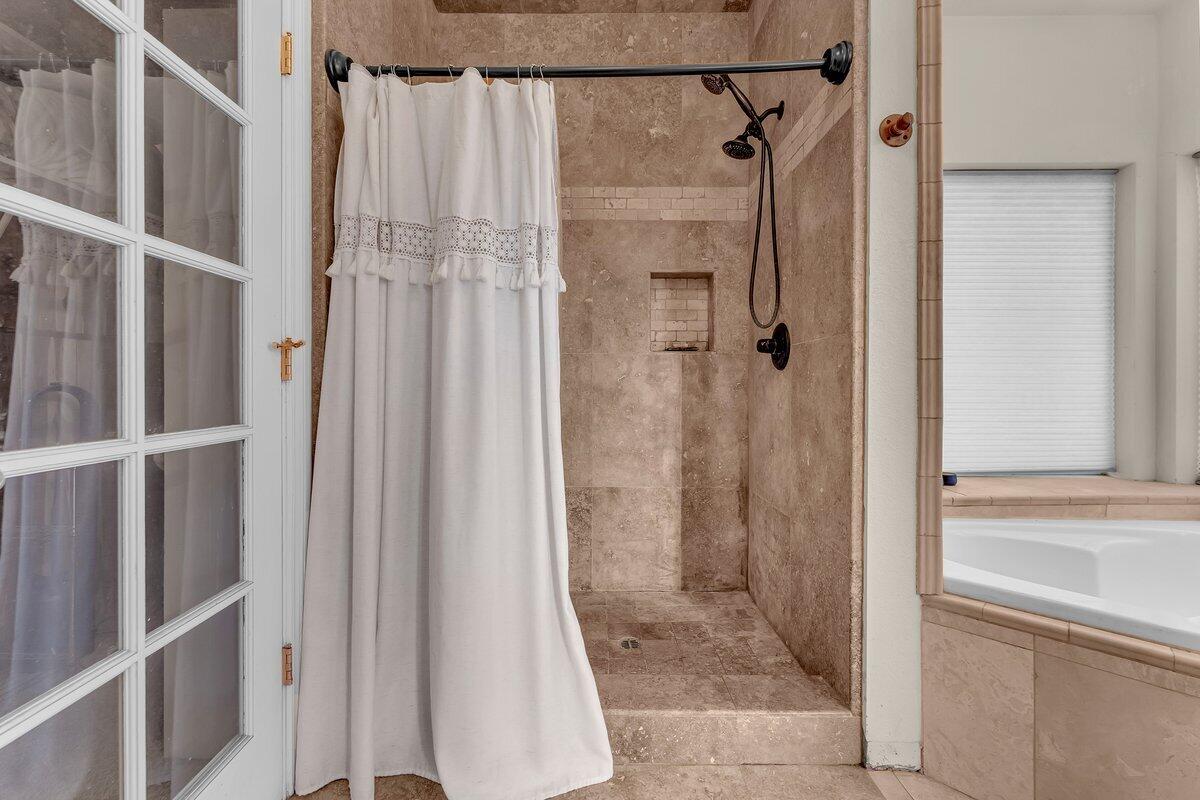 12757 Fern Road Whitmore, CA 96096 - Photo 25 of 62 a bathroom with a shower and a glass door