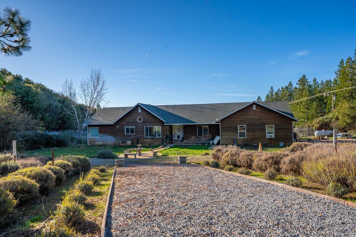 12757 Fern Road Whitmore, CA 96096 - Photo 6 of 62 a front view of a house with garden