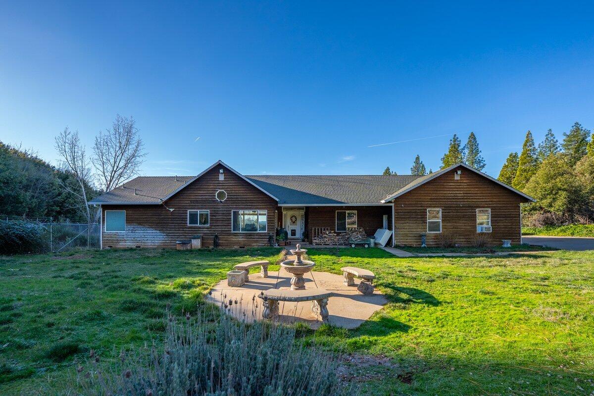 12757 Fern Road Whitmore, CA 96096 - Photo 7 of 62 a view of a house with a big yard potted plants and a large tree