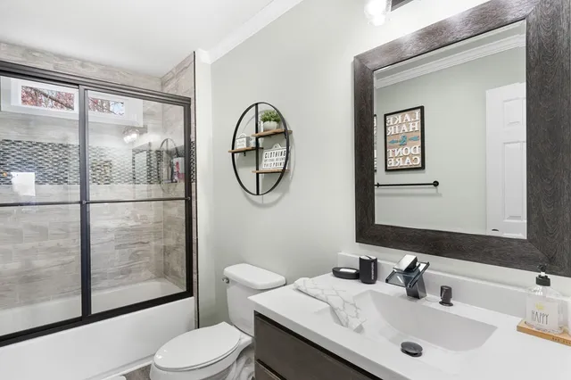 a bathroom with a glass shower door