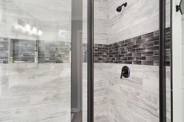 a bathroom with a sink double vanity and a mirror