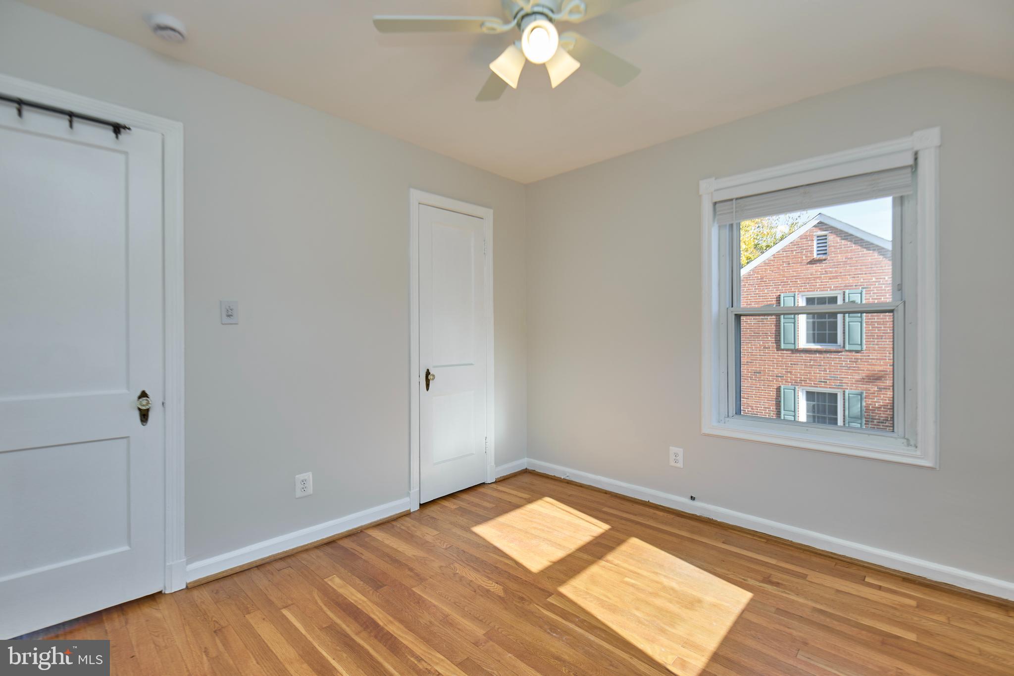 3727 2nd Street South Arlington, VA 22204 - Photo 17 of 30 a view of empty room with wooden floor and fan