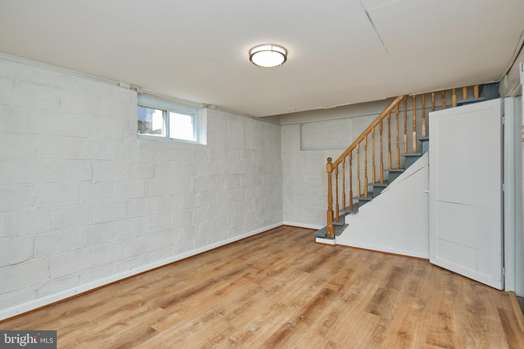 3727 2nd Street South Arlington, VA 22204 - Photo 20 of 30 a view of an empty room with wooden floor and a window