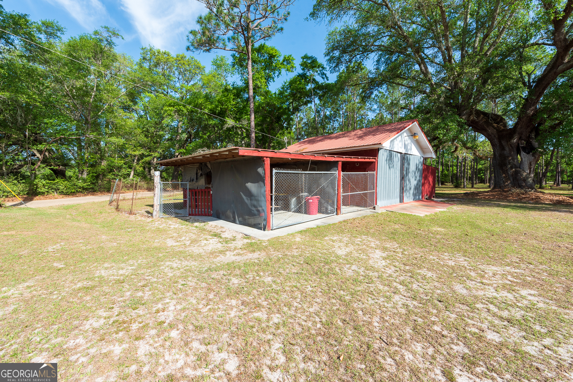 4582 St Johns Church Road Blackshear, GA 31516 - Photo 15 of 76 a view of a house with a yard and large tree