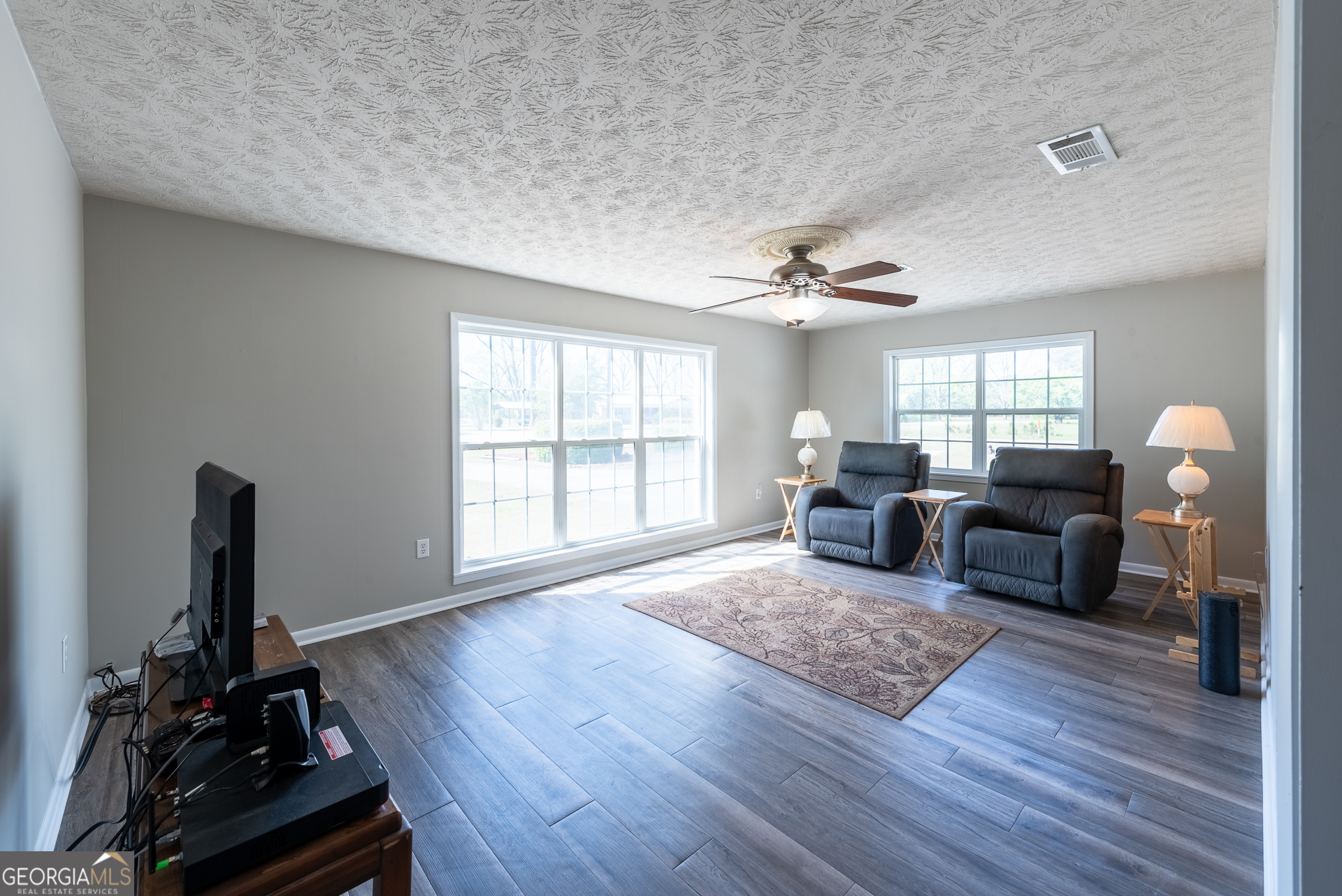 4582 St Johns Church Road Blackshear, GA 31516 - Photo 50 of 76 a living room with furniture window and wooden floor
