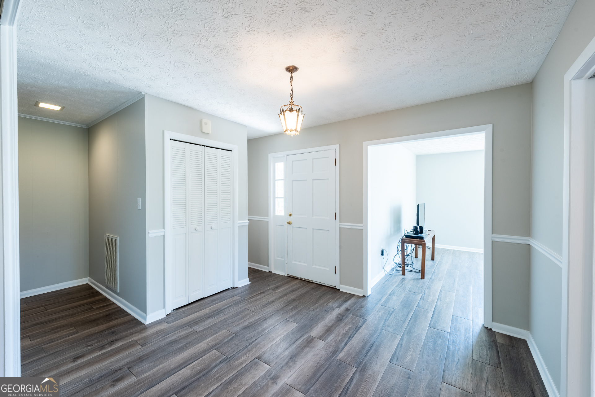 4582 St Johns Church Road Blackshear, GA 31516 - Photo 53 of 76 a very nice looking room with wooden floor and a ceiling fan