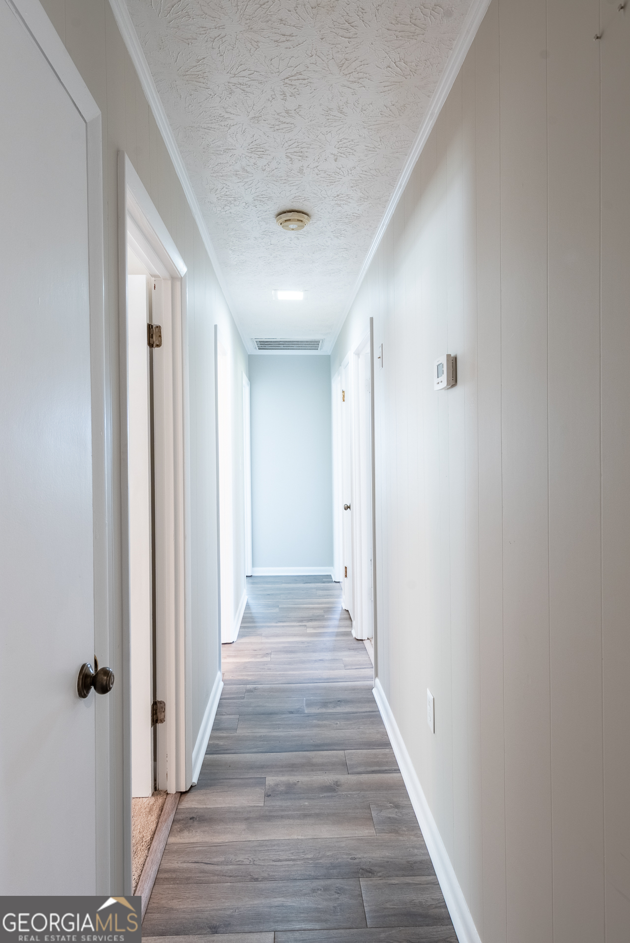 4582 St Johns Church Road Blackshear, GA 31516 - Photo 56 of 76 a view of a hallway with wooden floor