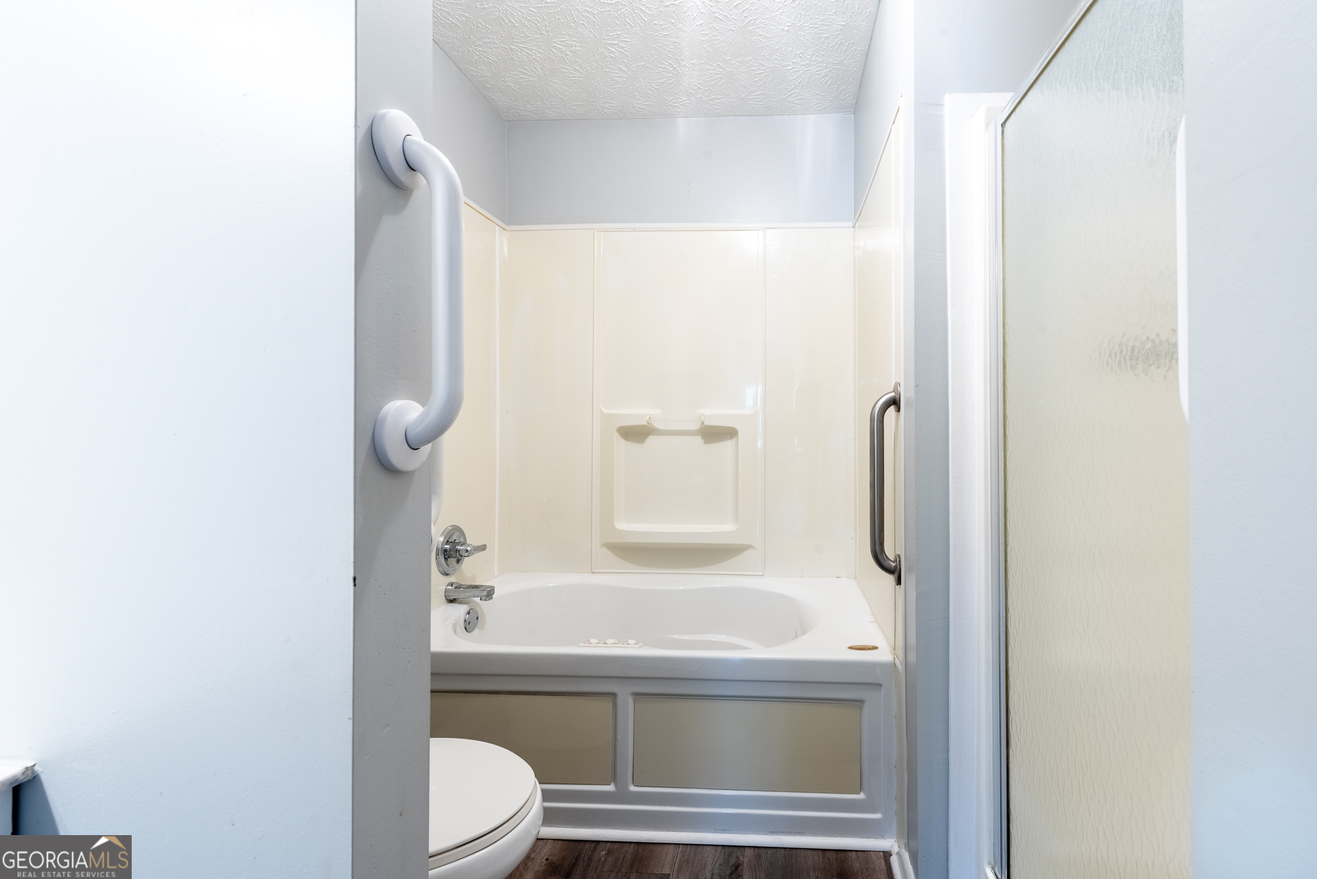 4582 St Johns Church Road Blackshear, GA 31516 - Photo 64 of 76 a bathroom with a granite countertop sink mirror vanity and toilet
