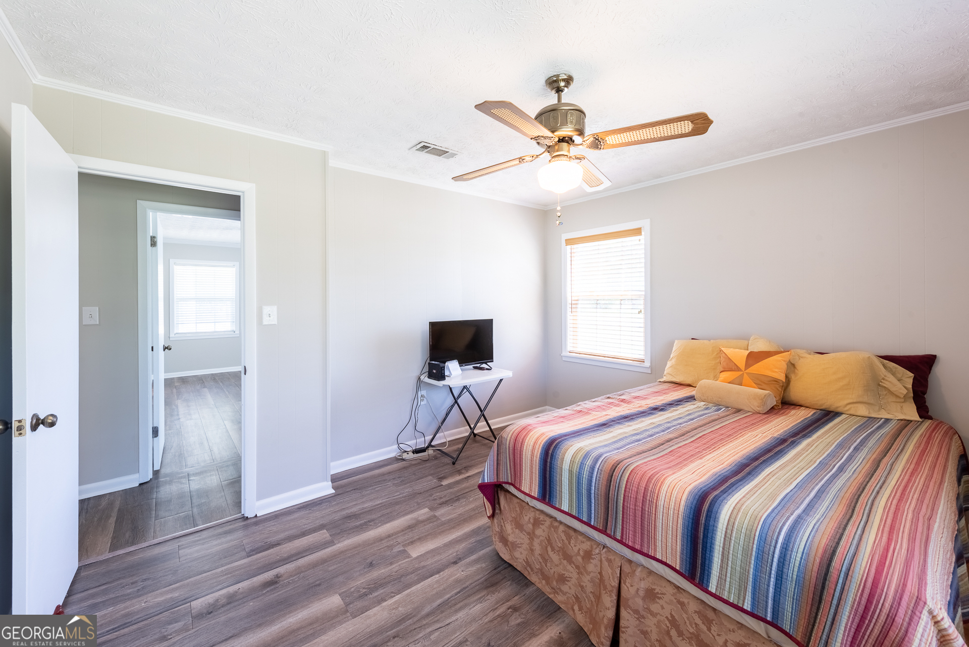 4582 St Johns Church Road Blackshear, GA 31516 - Photo 67 of 76 a bedroom with a bed and wooden floor
