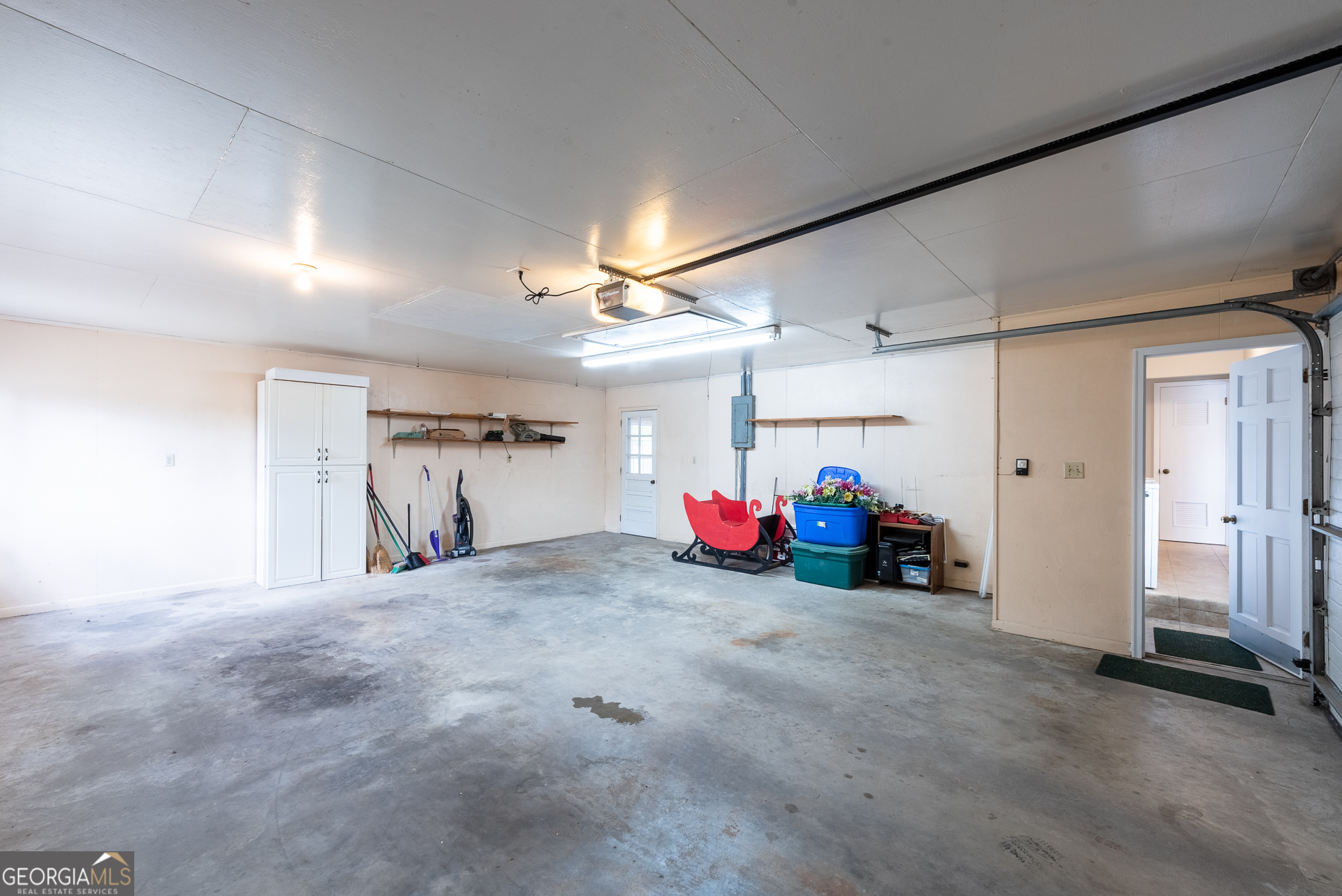 4582 St Johns Church Road Blackshear, GA 31516 - Photo 75 of 76 a view of a livingroom with furniture and a garage