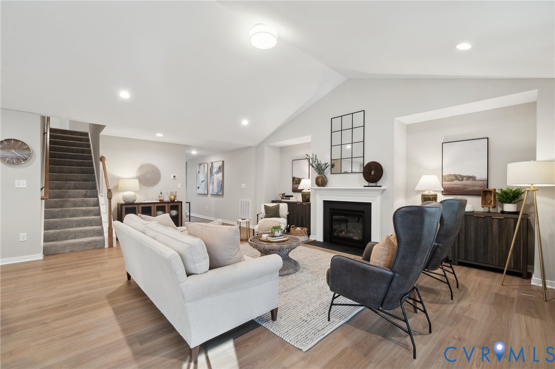 Tbd North Shore Road Locust Hill, VA 23092 - Photo 16 of 40 a living room with furniture a fireplace and a piano