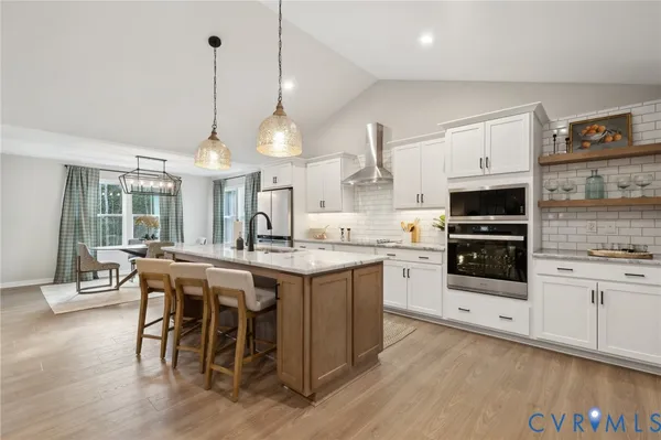 a kitchen with cabinets and stainless steel appliances