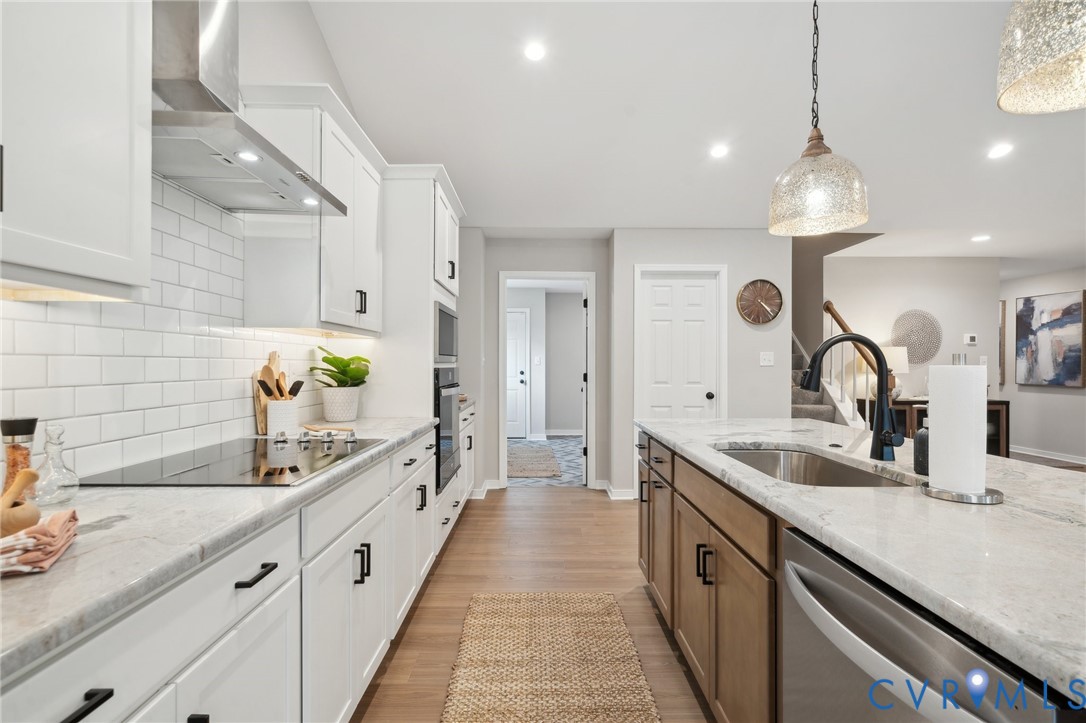 Tbd North Shore Road Locust Hill, VA 23092 - Photo 20 of 40 a large kitchen with granite countertop a sink and a refrigerator