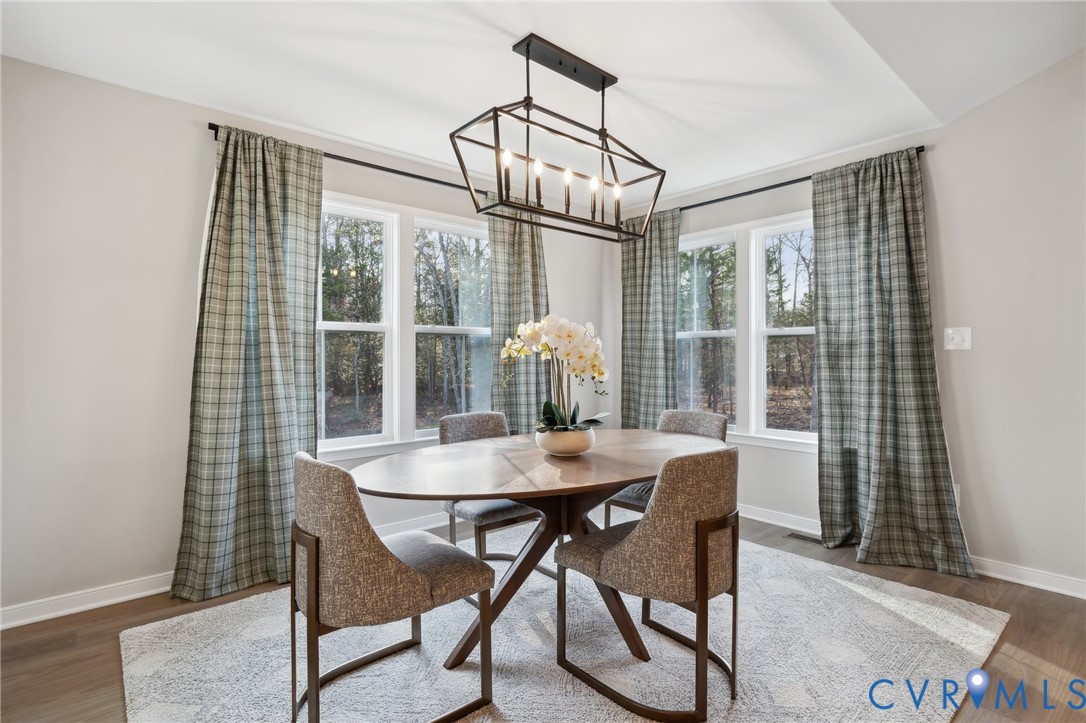 Tbd North Shore Road Locust Hill, VA 23092 - Photo 23 of 40 a view of a dining room with furniture window and wooden floor
