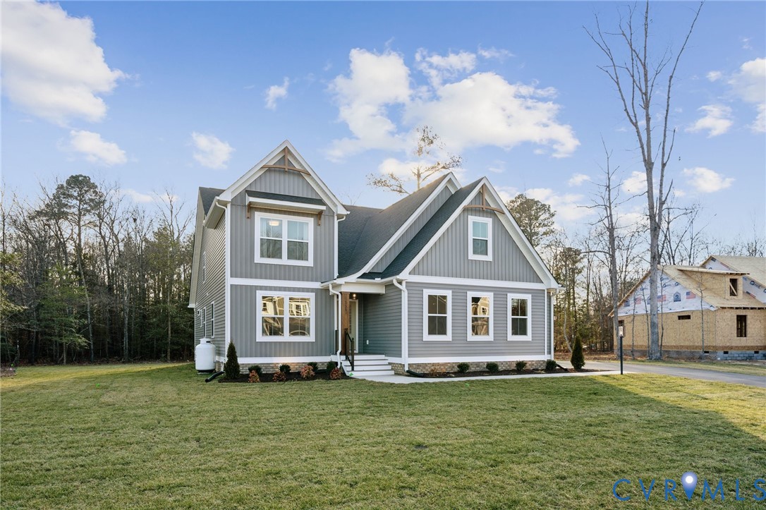 Tbd North Shore Road Locust Hill, VA 23092 - Photo 3 of 40 a front view of a house with a garden