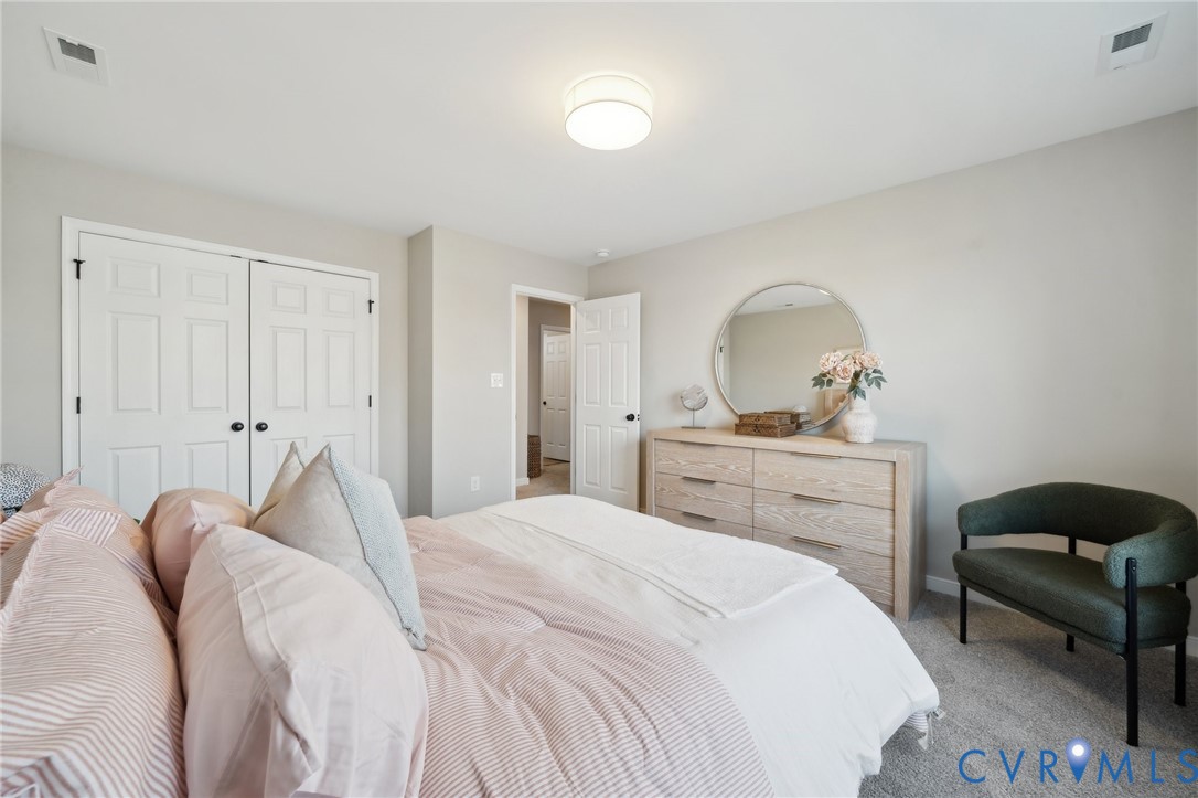 Tbd North Shore Road Locust Hill, VA 23092 - Photo 31 of 40 a bedroom with a bed and a mirror