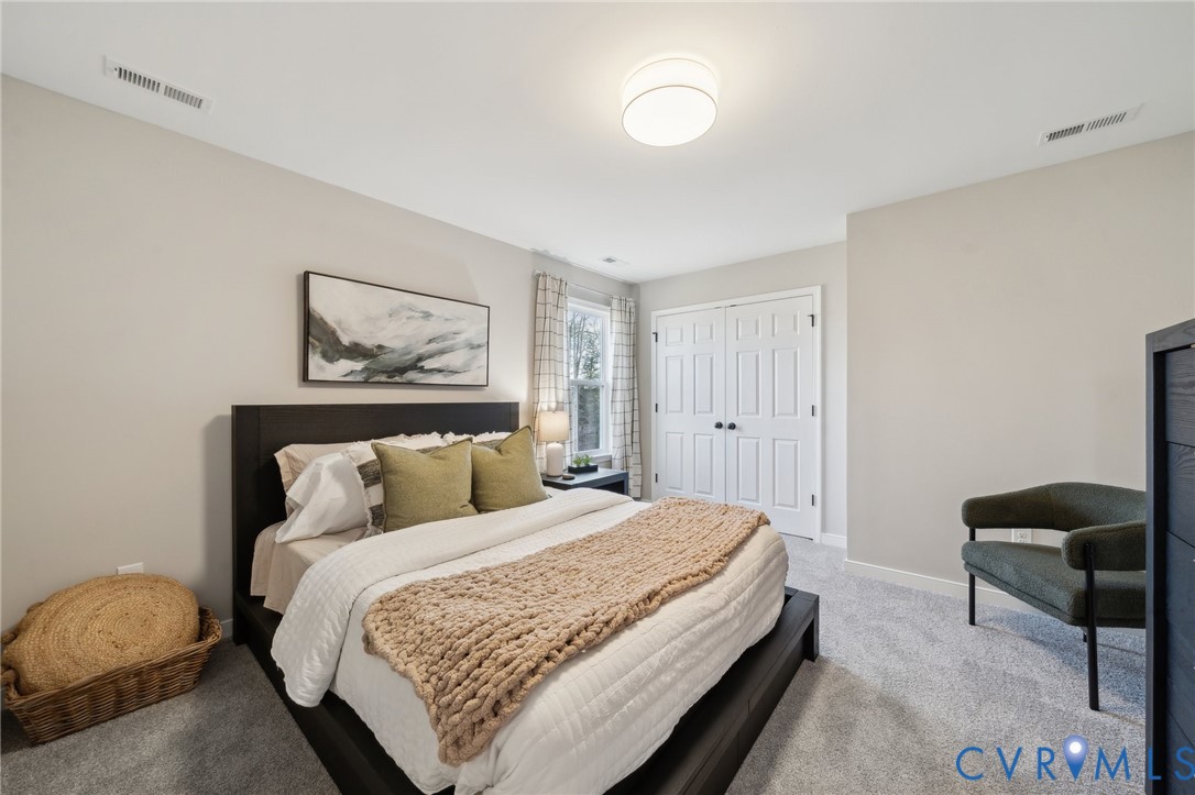 Tbd North Shore Road Locust Hill, VA 23092 - Photo 32 of 40 a bedroom with bed and a painting on the wall