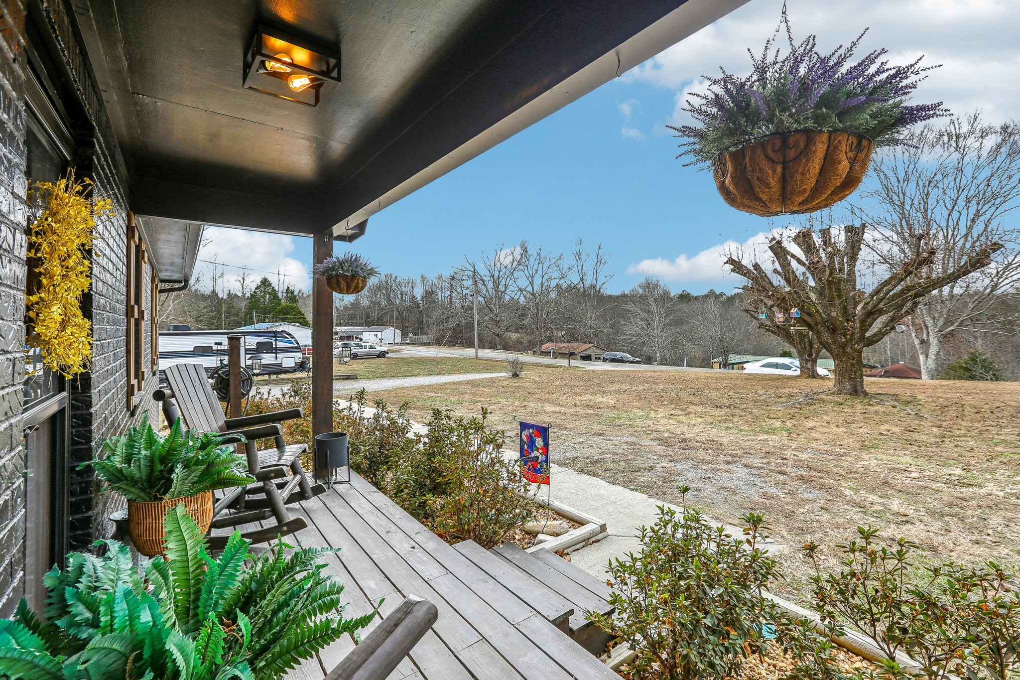 1776 Poss Road Smithville, TN 37166 - Photo 24 of 74 a view of a porch with furniture and garden
