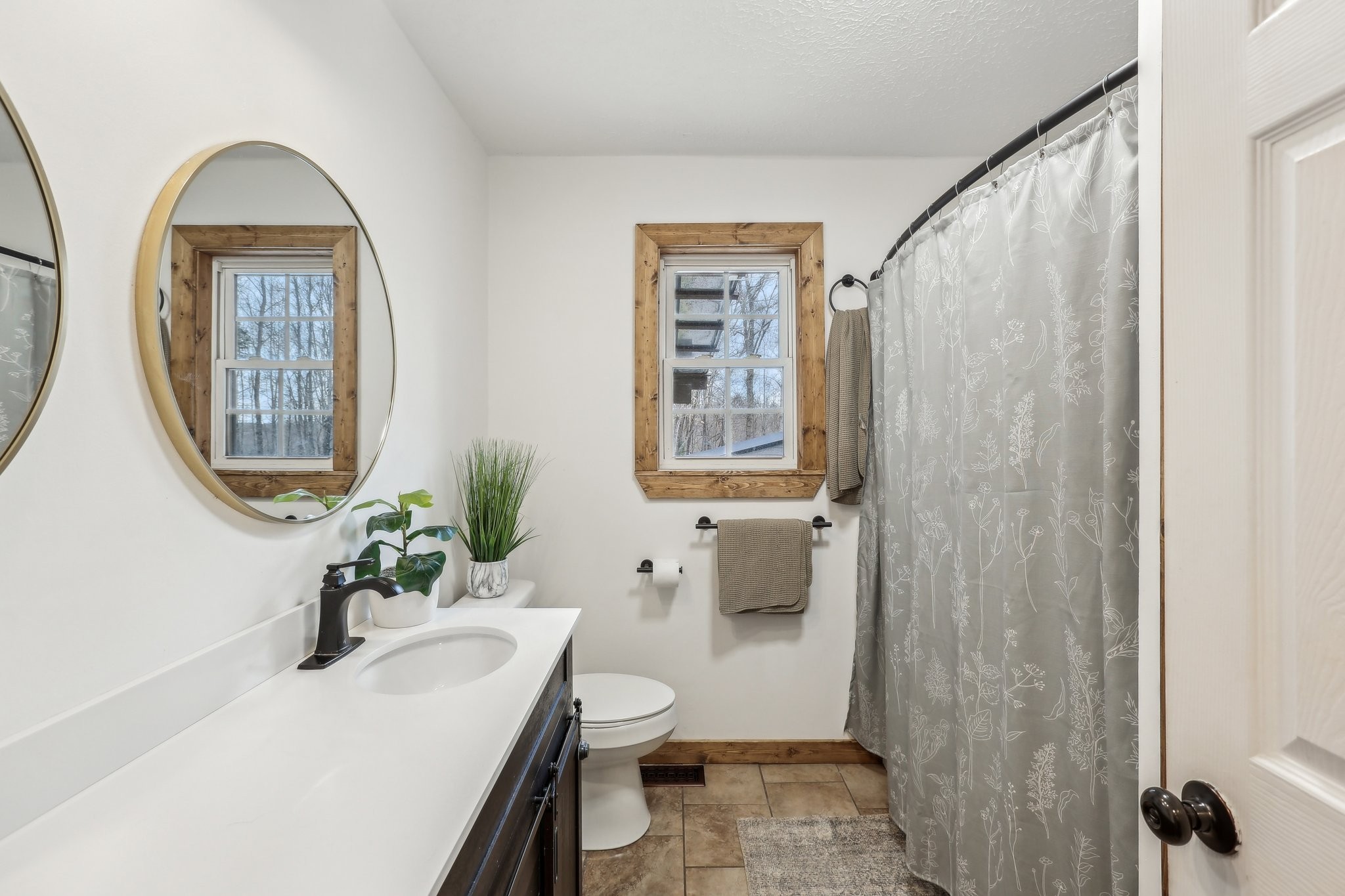 1776 Poss Road Smithville, TN 37166 - Photo 26 of 74 a bathroom with a toilet a sink and a mirror