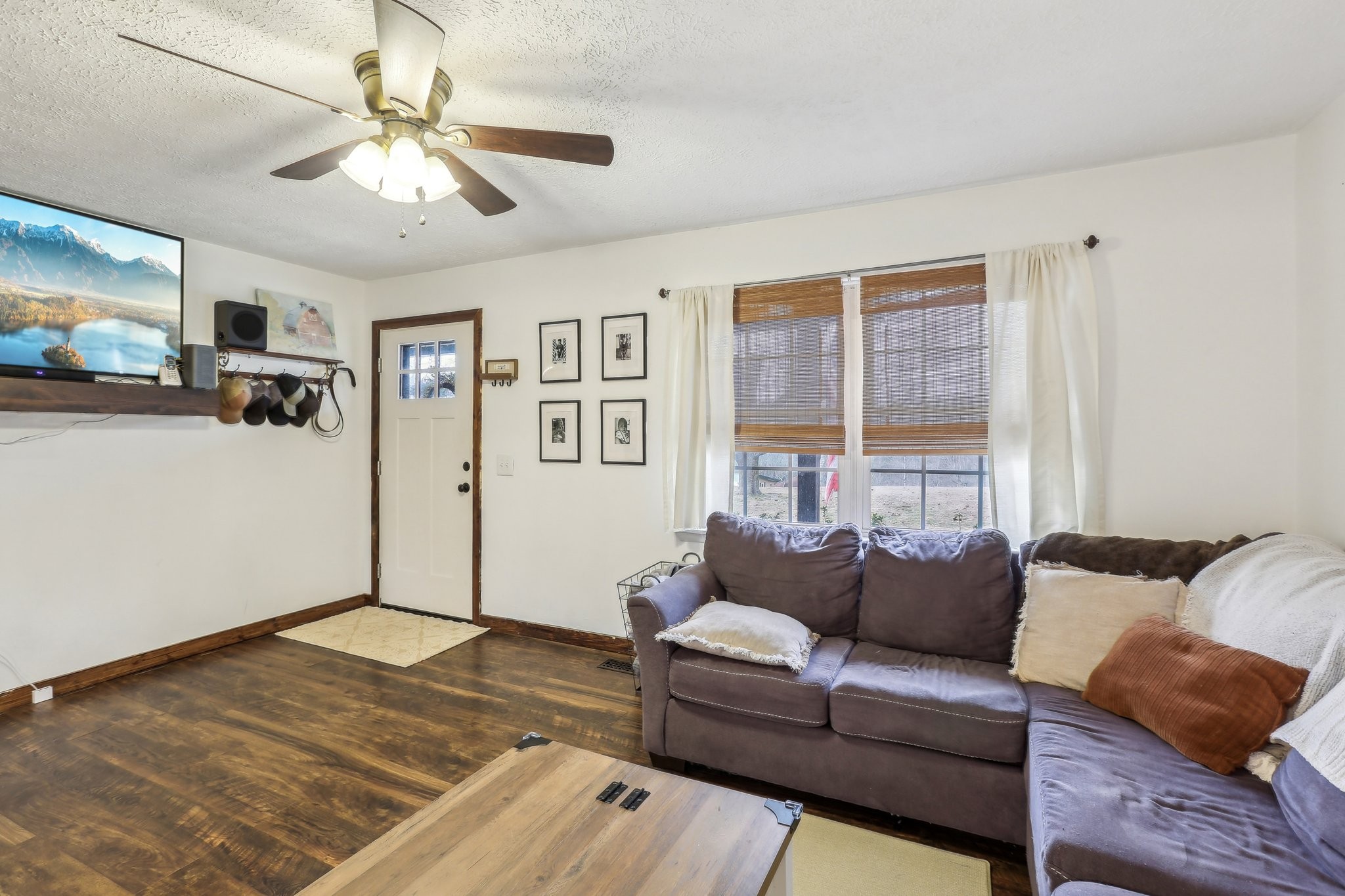 1776 Poss Road Smithville, TN 37166 - Photo 8 of 74 a living room with furniture and a flat screen tv
