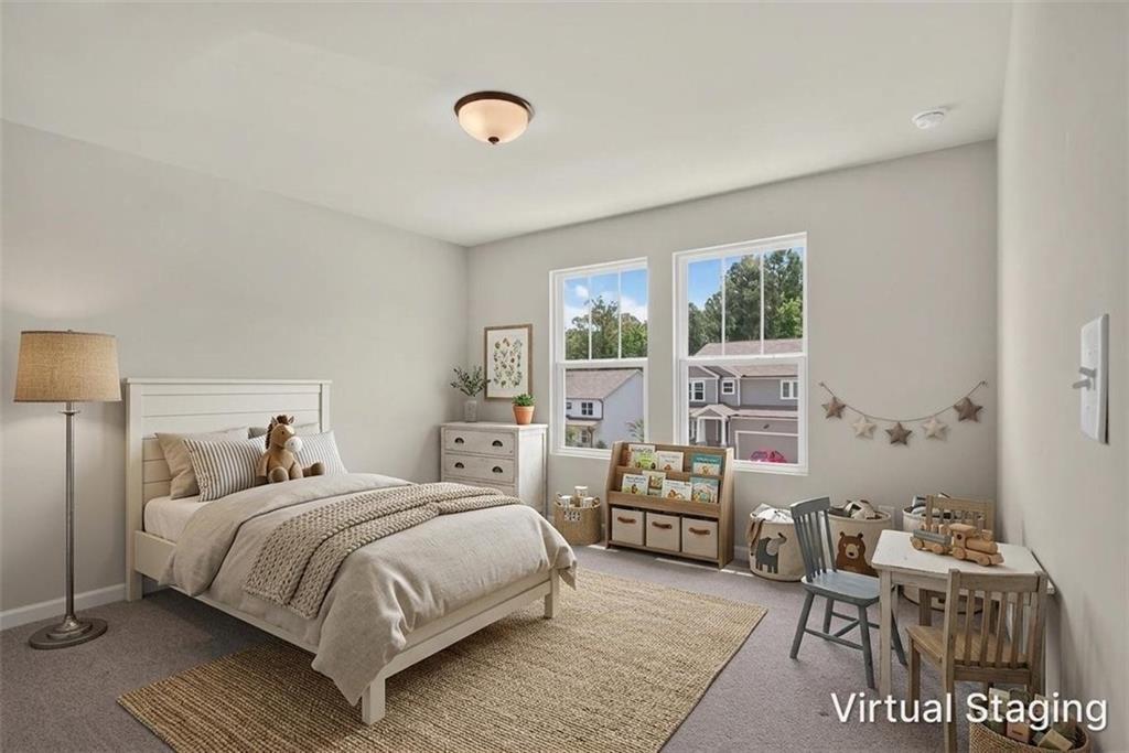 107 Ledgemont Way Acworth, GA 30101 - Photo 26 of 57 a bedroom with a bed and wooden floor