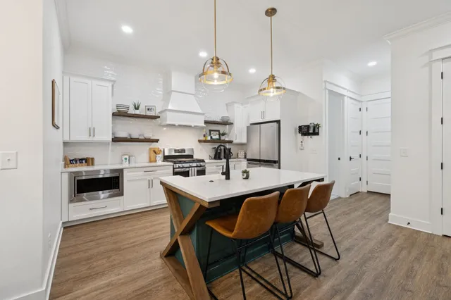 a living room with furniture fireplace and flat screen tv