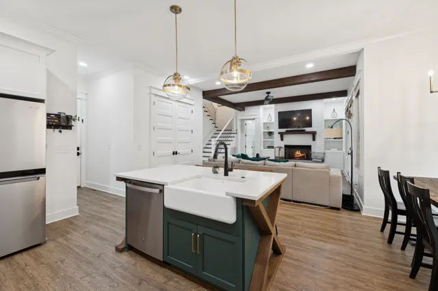 a spacious bedroom with a bed and a flat tv screen