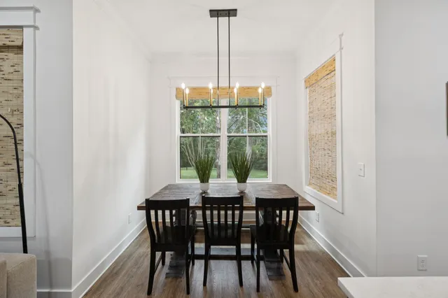 a bedroom with a bed and a flat tv screen on the dresser