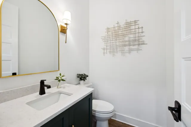 a view of storage and utility room with wooden floor