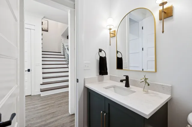 a bathroom with a sink double vanity and a shower