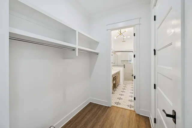 a bedroom with a bed lamp and window