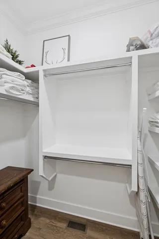 a bathroom with a granite countertop sink vanity mirror and toilet