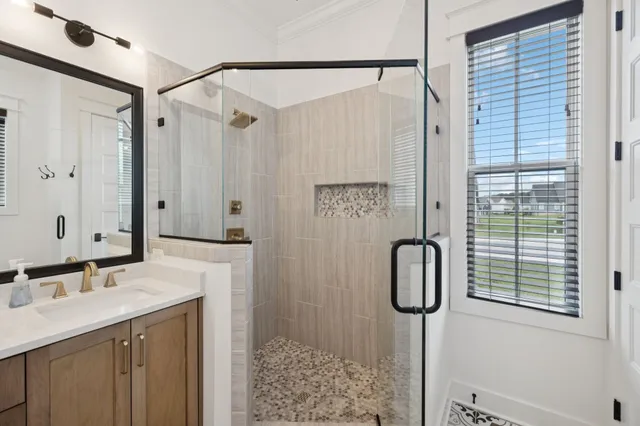 a spacious bedroom with a bed and a window