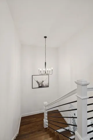 a living room with a bed furniture and a flat screen tv