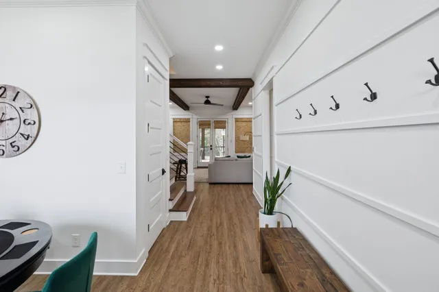 a view of a dining room with furniture and a floor to ceiling window