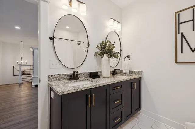 an aerial view of a house with a garden and lake view