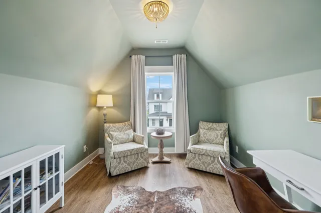 a view of a house with swimming pool and sitting area