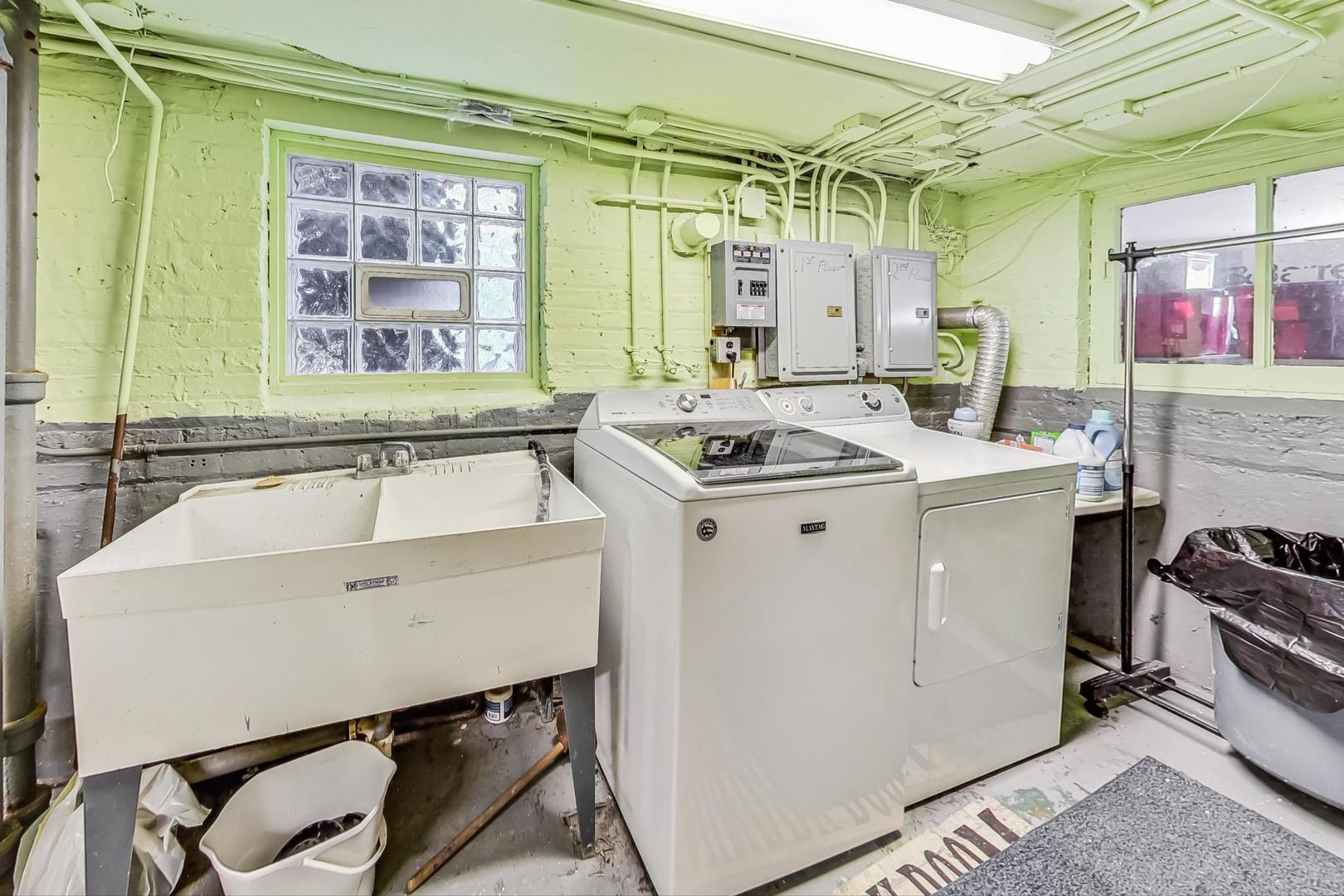 3929 North Drake Avenue Chicago, IL 60618 - Photo 46 of 60 a utility room with a sink a window and stainless steel appliances