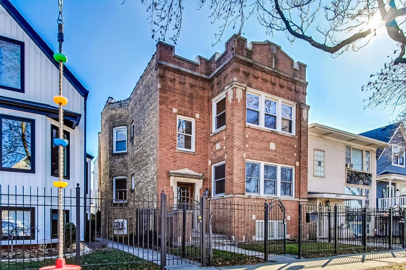 3929 North Drake Avenue Chicago, IL 60618 - Photo 59 of 60 a front view of a building with street view