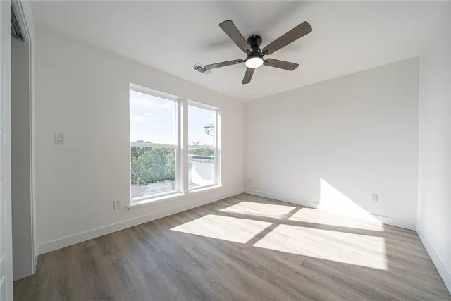 a bathroom with a granite countertop toilet a sink and shower