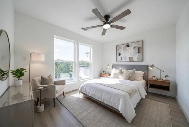 a bedroom with a large bed and a window