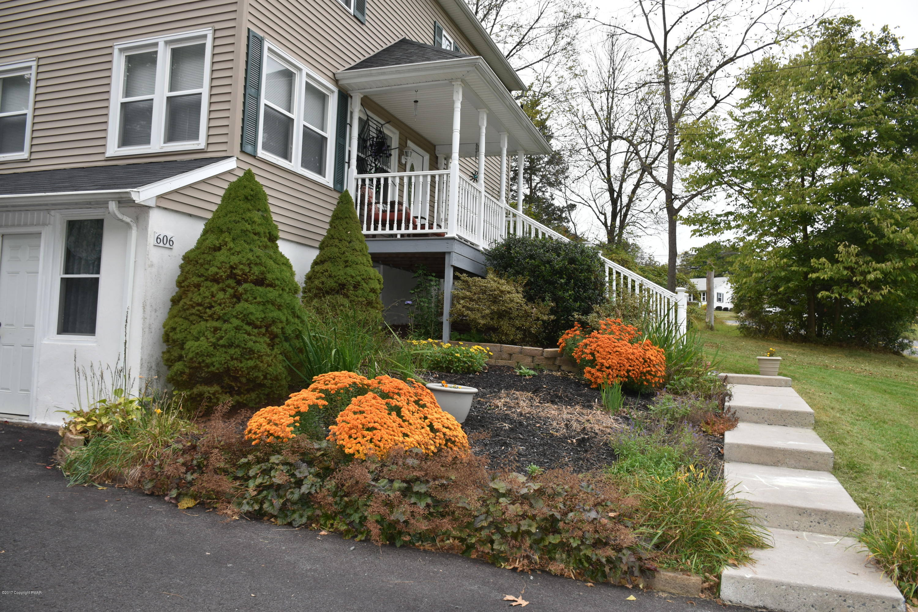 606 School Road Nazareth, PA 18064 - Photo 3 of 23 a front view of a house with garden