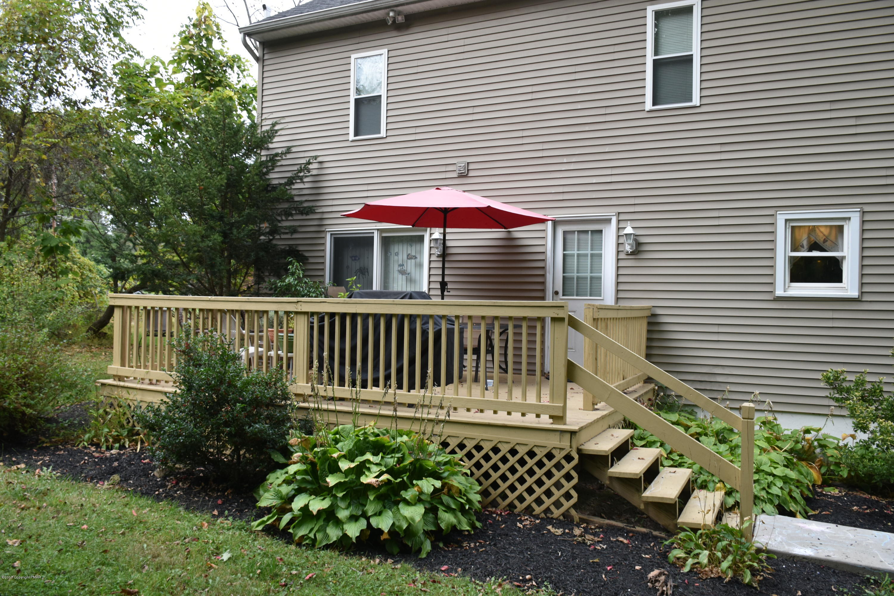 606 School Road Nazareth, PA 18064 - Photo 4 of 23 a front view of a house with a garden