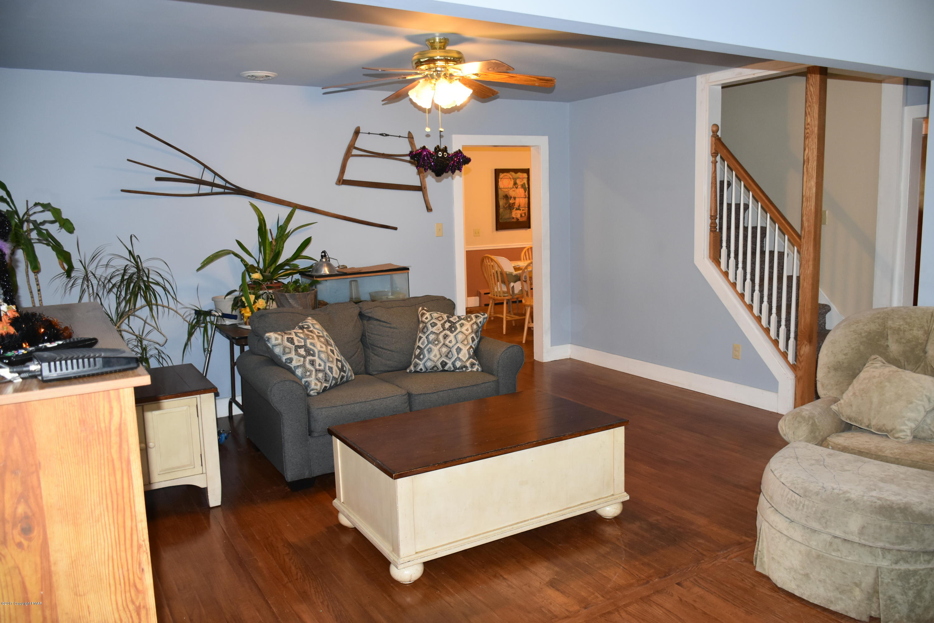 606 School Road Nazareth, PA 18064 - Photo 7 of 23 a living room with furniture and a chandelier
