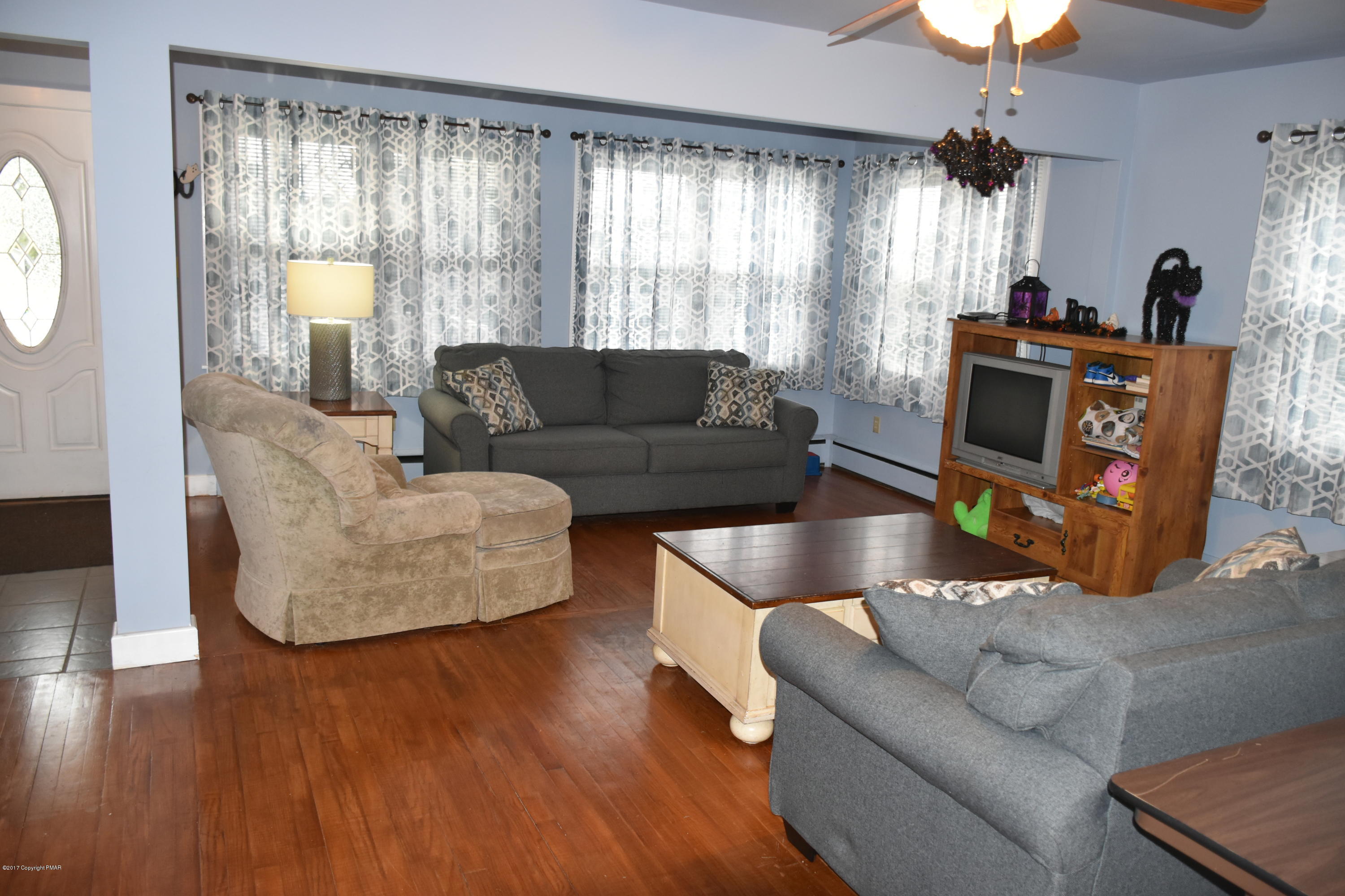 606 School Road Nazareth, PA 18064 - Photo 8 of 23 a living room with furniture and a large window