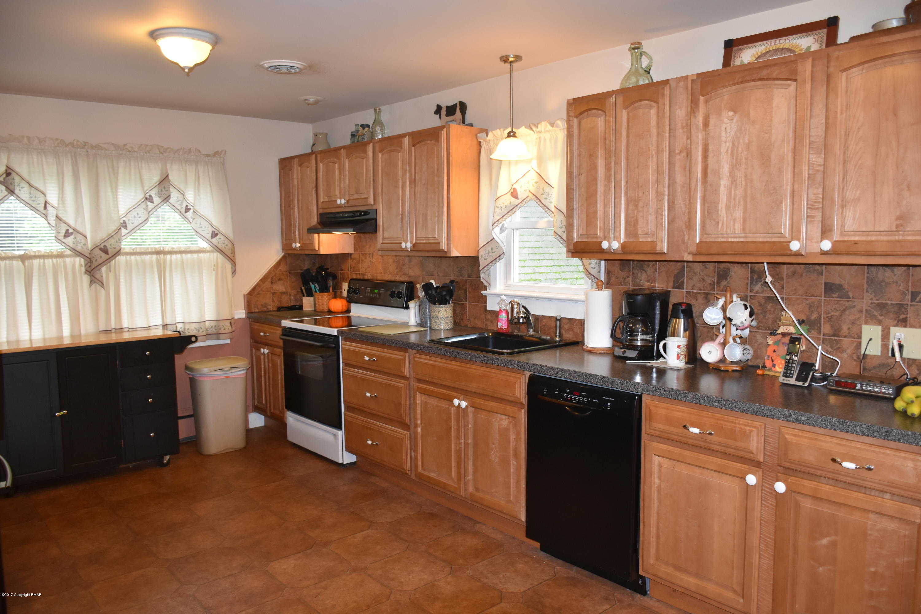 606 School Road Nazareth, PA 18064 - Photo 10 of 23 a kitchen with a sink stove and cabinets