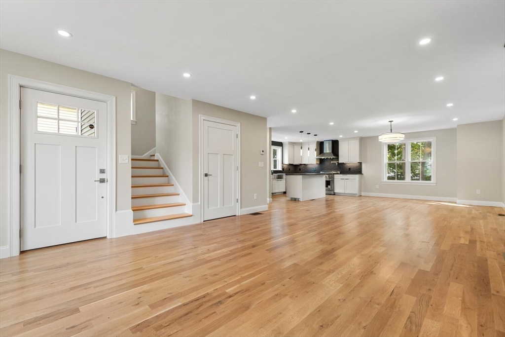 17 Emerson Street Stoneham, MA 02180 - Photo 15 of 41 a view of a livingroom with wooden floor and staircase